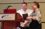 Jonathan S. Comer, PhD receives his award from Div. 37 president Mary Ann McCabe, PhD, ABPP 