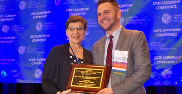 New York’s Executive Director Tom Cote, MBA, CAE, near right, was named outstanding SPTA staff person. The well-deserved award was presented by Div. 31 President Dinelia Rosa, PhD. 