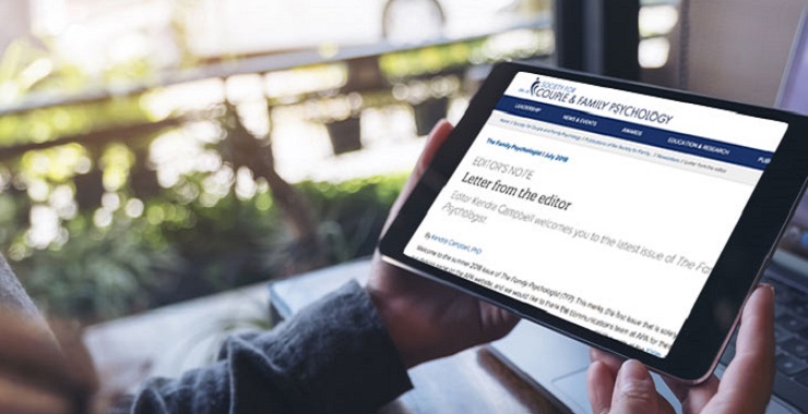 An individual reading The Family Psychologist newsletter on a tablet