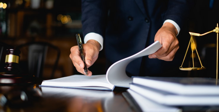 Judge writing in notebook