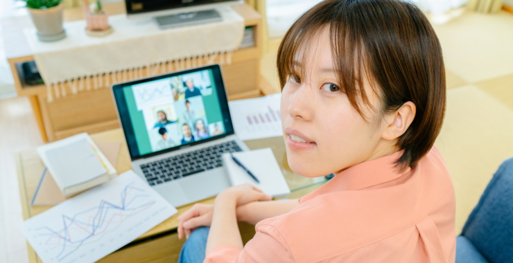 Student facing away from laptop