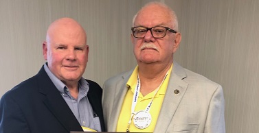 Bruce Bobbitt, PhD, receives the Outstanding Psychologist Award from Bruce Nystrom, PhD. 