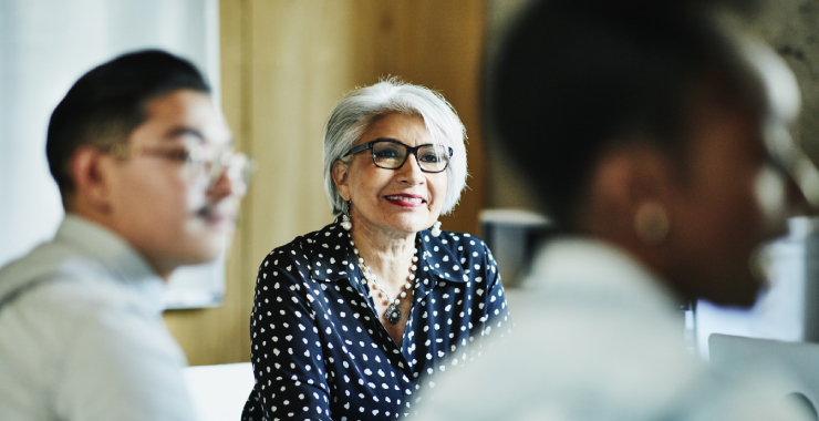 an older woman in group setting