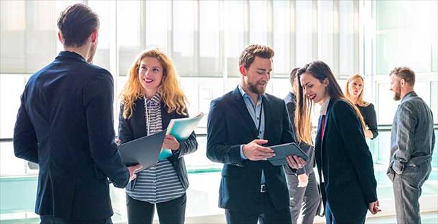 Early career psychologists networking at an event