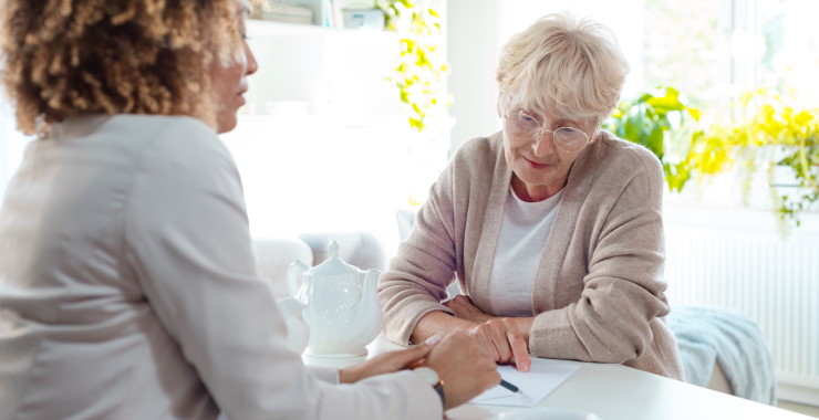 older woman talking to a younger one.