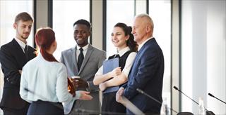 group of professionals standing and talking