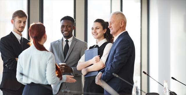 group of professionals standing and talking