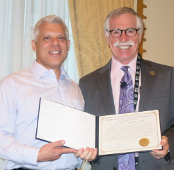 Dr. Allen M. Omoto receives a presidential citation.