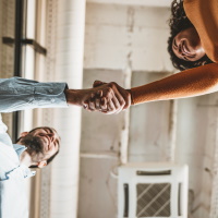 man and woan shaking hands.