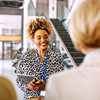 woman wearing a conference lanyard