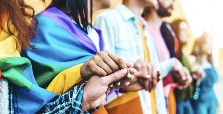 Diverse group of young people celebrating gay pride festival day
