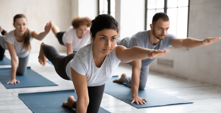 group practicing  yoga